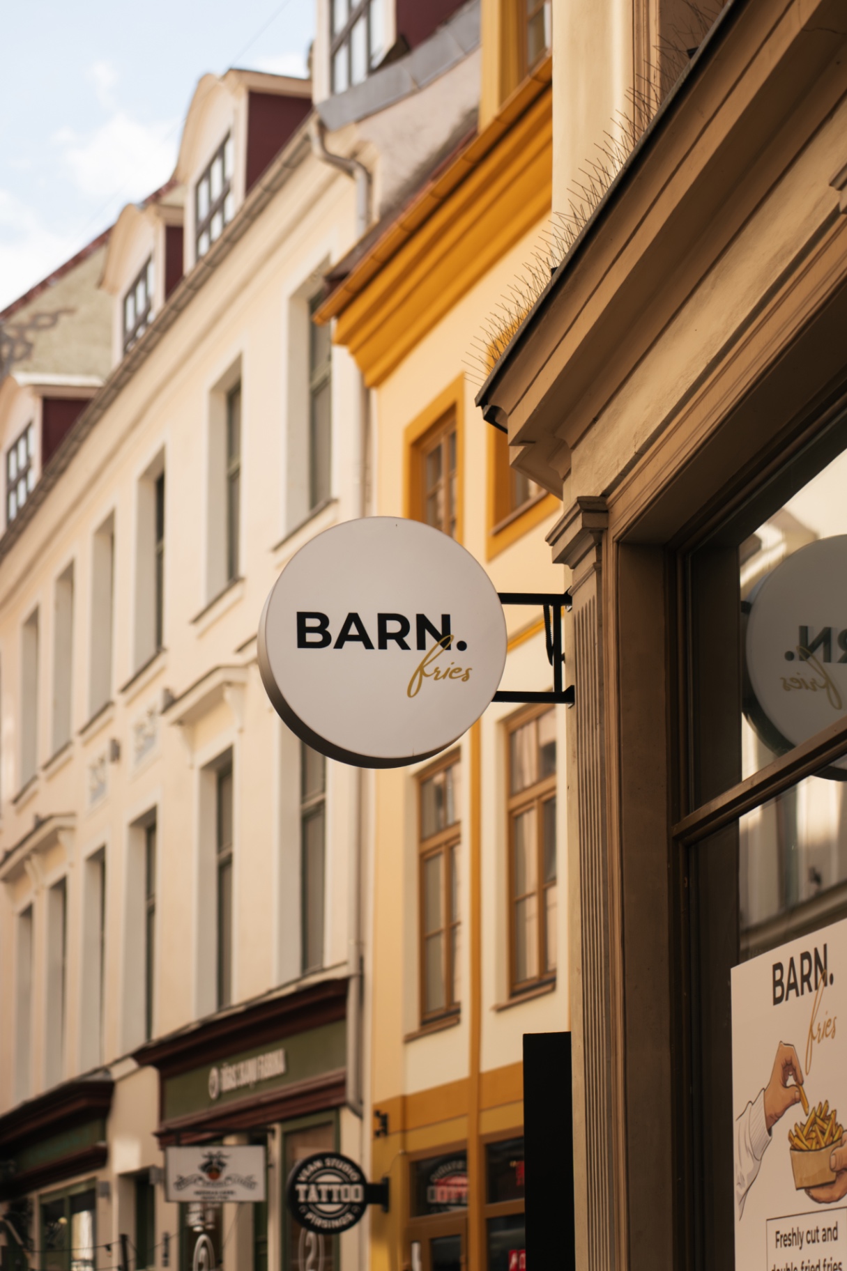 BARN. fries storefront sign on Šķūņu iela, Old Town Riga